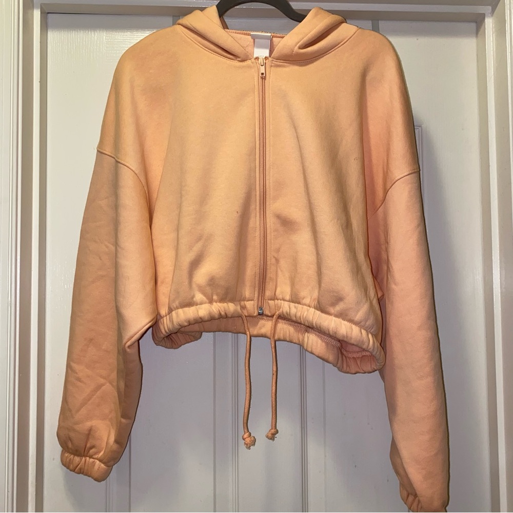 H&M drawstring sweatshirt. Orange. size Med